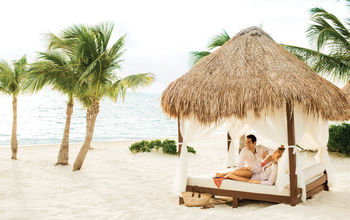 A couple relaxing at Excellence Playa Mujeres