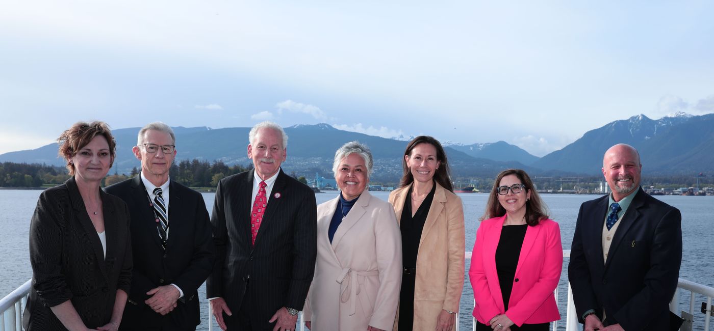 Image: (from left): Kathy DeLisser, Tom Corsie, John Waggoner, Rosalind Campbell, Karen Soyka, Carmen Ortega, and Dean Wendt (American Queen Voyages)