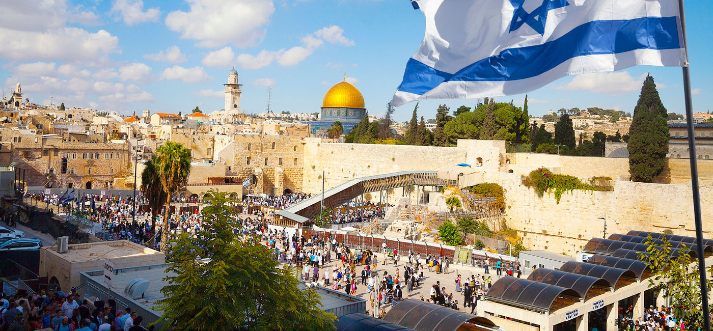 Image: Israel's national flag flies over the old city of Jerusalem. (photo via iStock/Getty Images E+/stellalevi)