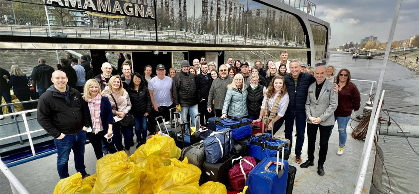 Image: Ensemble top producers brought donations for Ukraine to Europe. (photo courtesy Ensemble Travel Group) (Ensemble)
