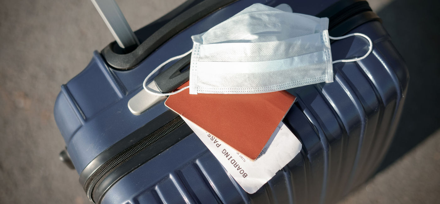 Image: Covid cases are leading to a stall in travel. (photo via elenaleonova / iStock / Getty Images Plus)