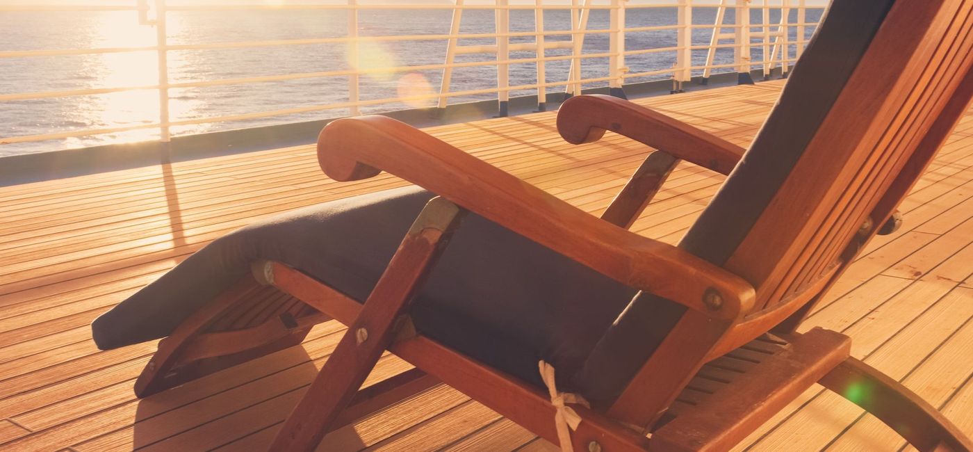 Image: Deck chair on a cruise ship on the promenade deck. (photo via grandriver/Getty Images)