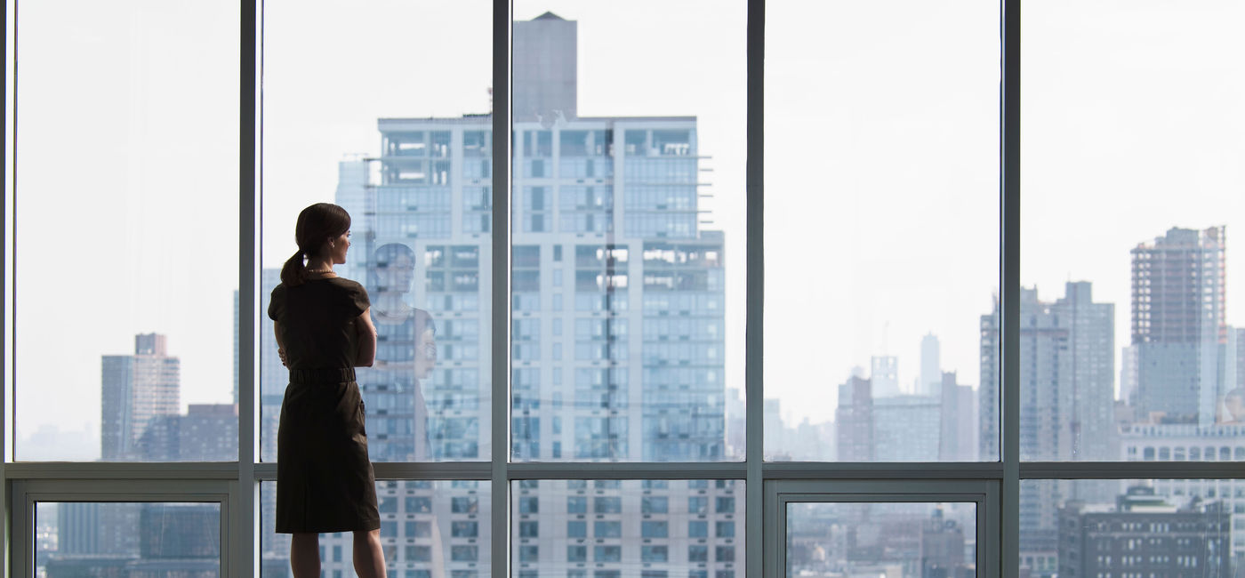Image: Woman looking at skyline (Getty/Ryan McVay)
