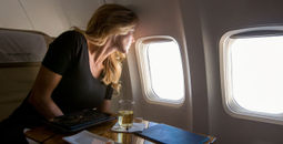 Abercrombie & Kent, A&K private jet journeys, private jets, airplane, woman traveler, woman in airplane