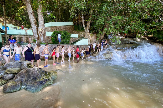Tourists getting ready to climb Dunn's River Falls near Ocho Rios, Jamaica
