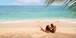 Couple on the beach at Sandals Grenada