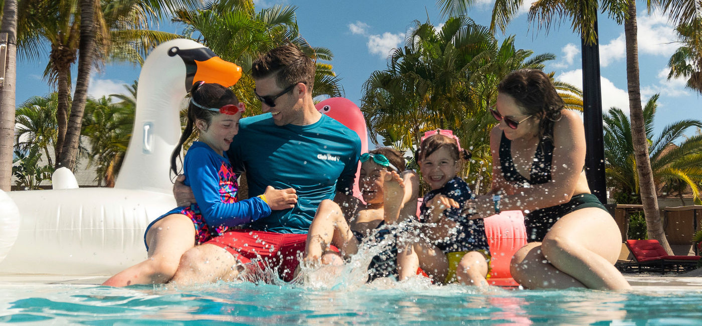 Image: Family playing in the pool at Club Med Sandpiper Bay. (photo via Club Med) (Courtesy of Club Med Sandpiper Bay)