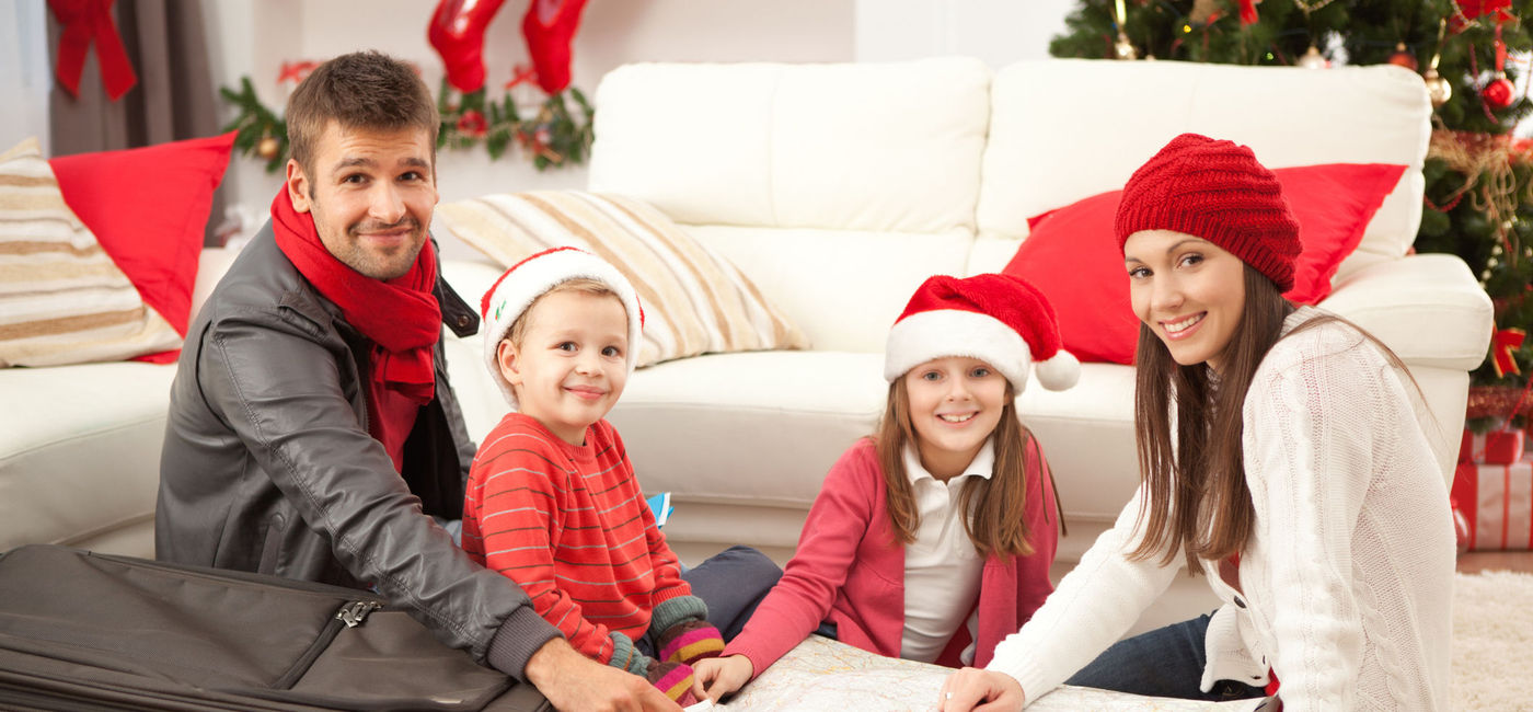 Image: Family making plans for holiday travel. (photo via iStock/Getty Images Plus/svetikd)