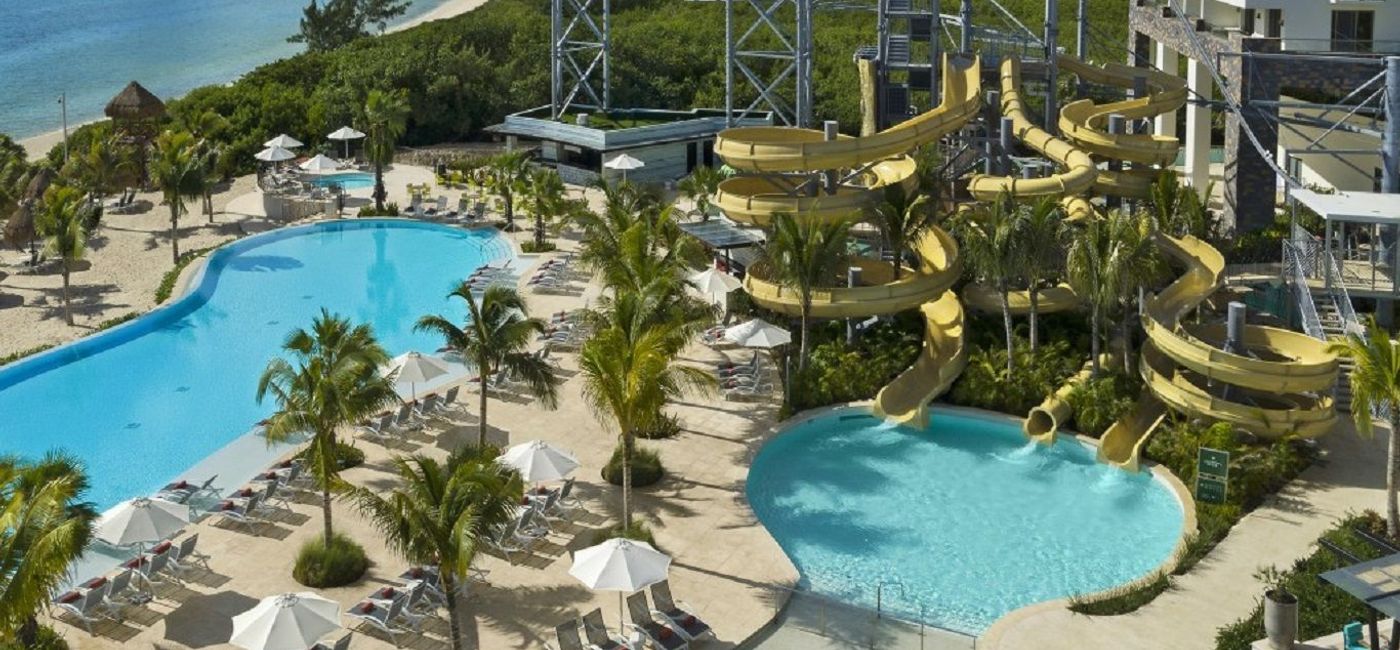 Image: Pools and waterpark at Dreams Natura Resort & Spa. (photo via AMResorts)