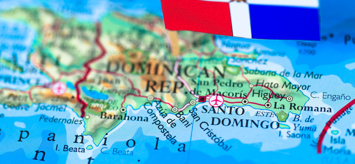 Image: Flag of the Dominican Republic pinned onto a map. (photo via iStock/Getty Images E+/pawel.gaul)