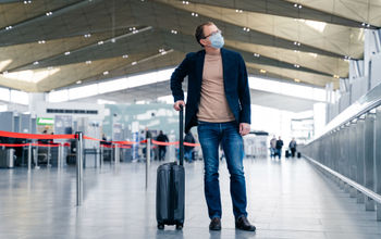 Traveler wearing a face mask at the airport