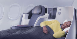 American Airlines passenger using First Class lie-flat seat