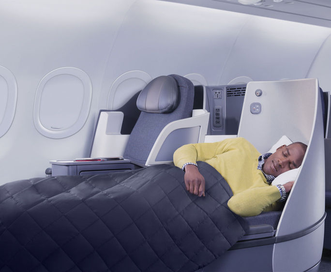American Airlines passenger using First Class lie-flat seat