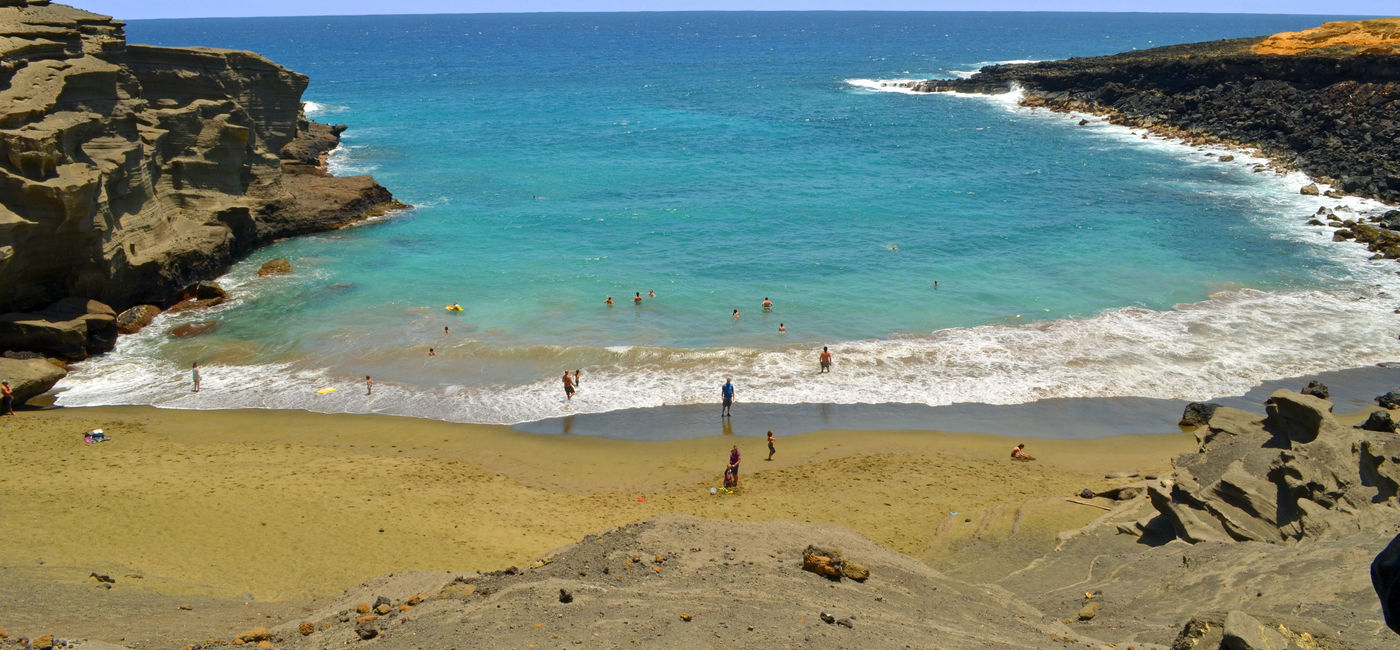 Image: PHOTO: Hawaii's Papakolea Beach is known for its unique olive green sand. (photo via EvaKaufman/iStock/Getty Images Plus)