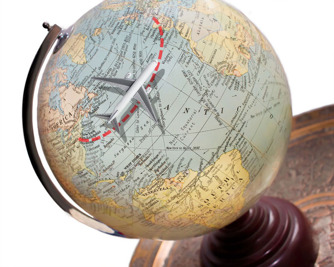 Transatlantic airplane route depicted on a globe. Transatlantic, airplane, plane, jet, airline, route, globe, U.S., United States, Europe