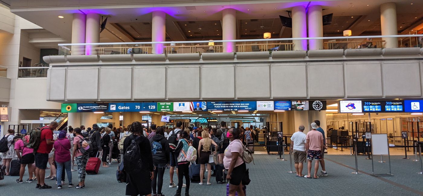 Image: Crowd of people waiting for TSA security line at Orlando Airport (photo by Eric Bowman)