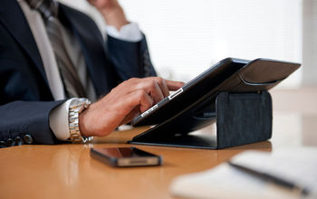 Professional, business individual with tablet and smartphone