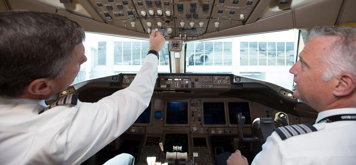 Image: American Airlines pilots at the controls in cockpit. (photo via American Airlines)