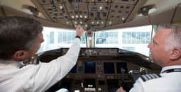 American Airlines pilots at the controls in cockpit
