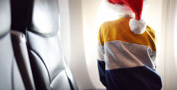 Young child on an airplane during holiday season.