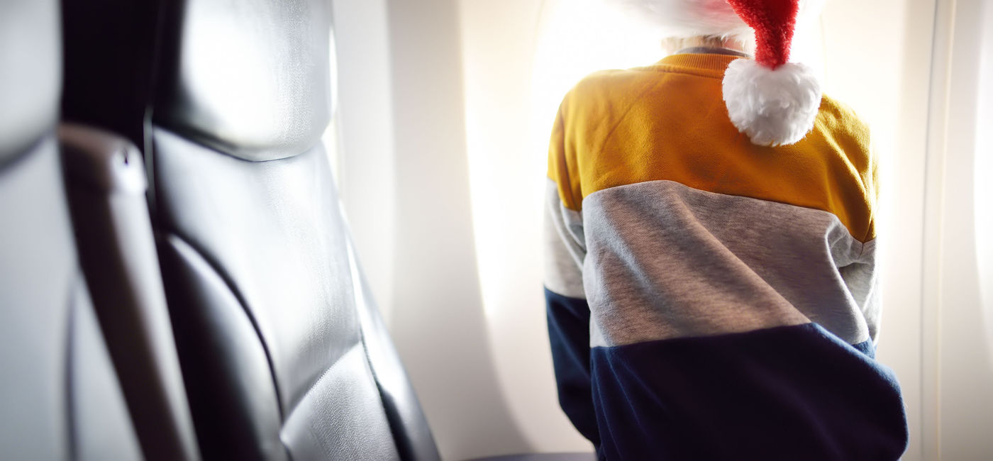Image: Winter travel can be stressful for families but it doesn't have to be. (Photo Credit: iStock / Getty Images Plus)