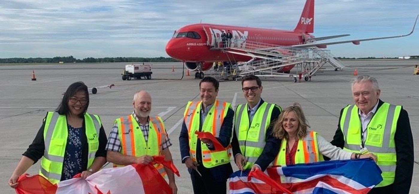 Image: Hamilton city councillors Tammy Hwang (far left), and Mark Tadeson (second left) joins PLAY airlines’ CEO Birgir Jónsson (middle left), Cole Horncastle, executive managing director, YHM (middle right), Cathie Puckering, vice president and head, Canadian Network Vantage Airport Group (right) and Ed Minich, board of director, YHM (far right) to cut the ribbon introducing the inaugural flight to Canadian travellers. (PLAY)