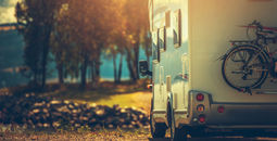 RV driving during the late afternoon in the fall.