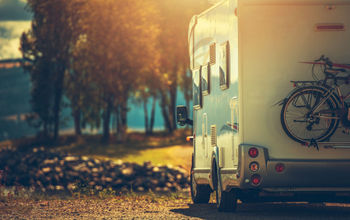 RV driving during the late afternoon in the fall.