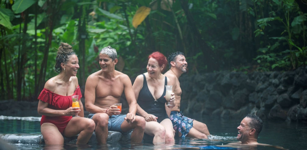 Travelers enjoy La Fortuna's hot springs in Costa Rica on a G Adventures' Geluxe trip. G Adventures, la fortuna, hot springs, luxury tours, Geluxe, Costa rica