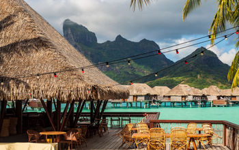 Outdoor terrace with view of lagoon and mountain