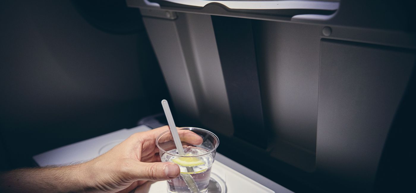 Image: PHOTO: Alcohol drink on board airplane (photo via Chalabala / iStock / Getty Images Plus)