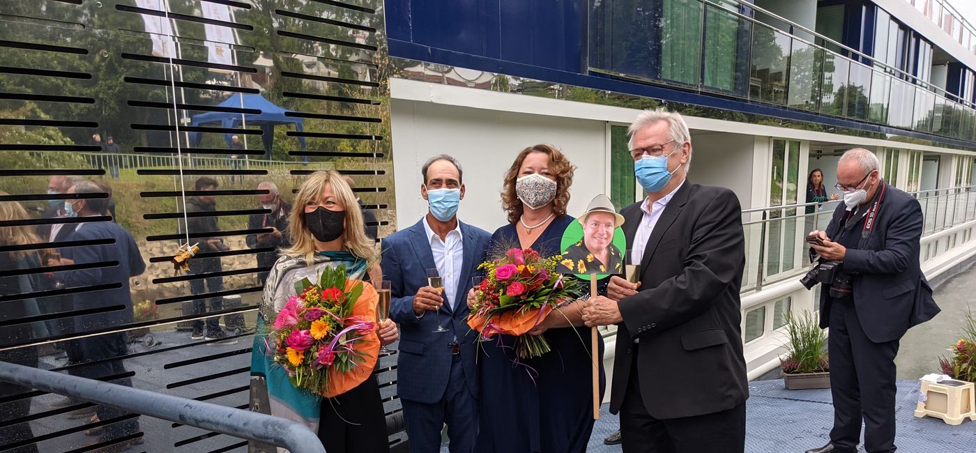 Image: AmaSiena Godmother Debbie Fiorino and her husband Joe (center) pose for a photo with AmaWaterways' co-founders Kristin Karst (left) and Rudi Schreiner (right) (photo by Eric Bowman)
