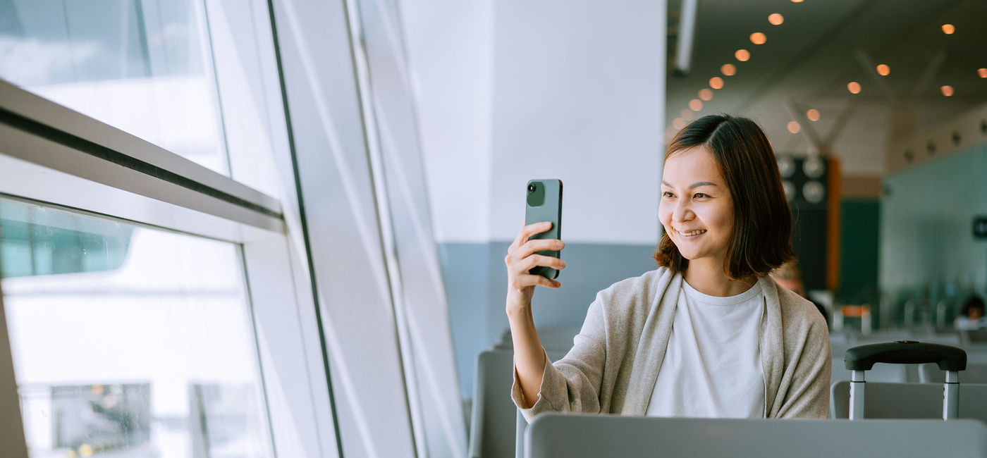 Image: With the new app, travelers take a photo as a "selfie," which will be compared to a photo gallery to verify their identity through facial biometrics. (Photo Credit: KSChong/E+)