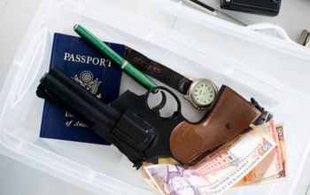 Gun in airport screening tray.