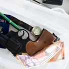 Gun in airport screening tray.