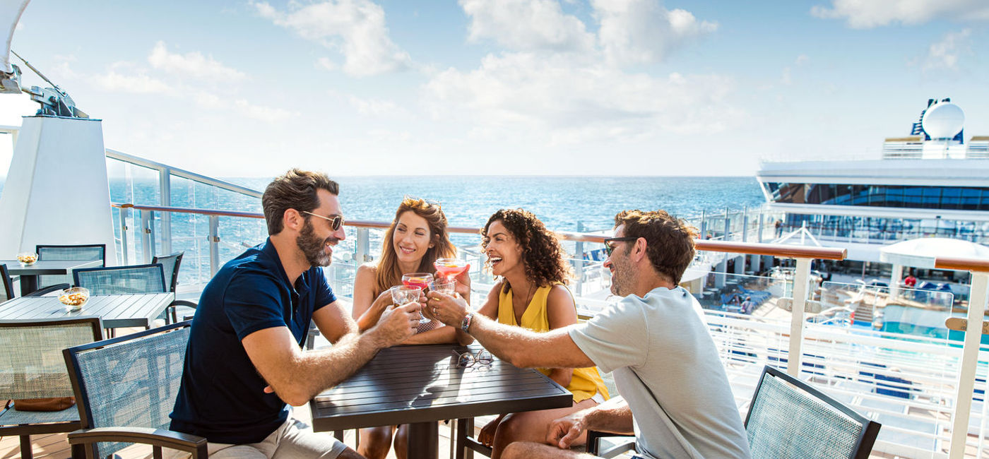 Image: PHOTO: Friends enjoying cocktails at Sky High Bar aboard Norwegian Star. (photo courtesy of Norwegian Cruise Line)