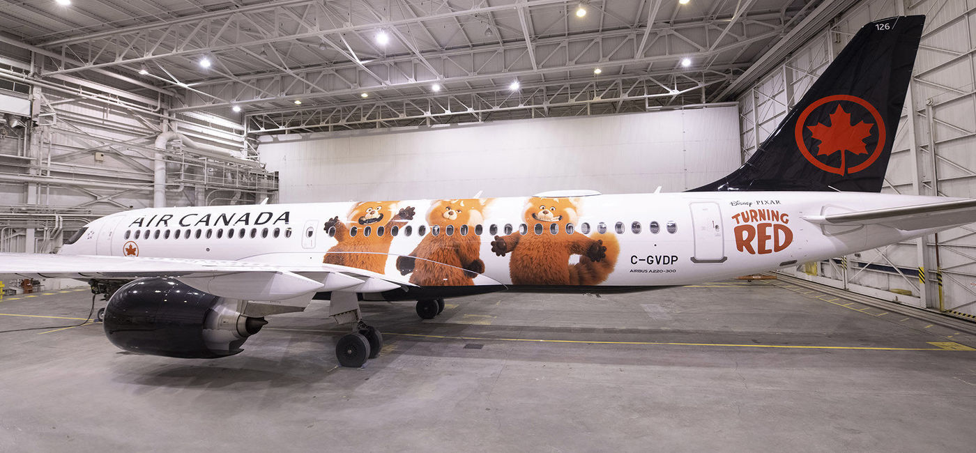 Image: The new livery on a Canadian-built Air Canada A220 celebrates the launch of new film Turning Red. (Air Canada)