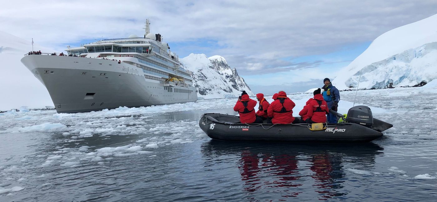 Image: Silver Endeavour sailed into Lemaire Channel with guests and travel advisors nearby in motorized Zodiac rafts. (Photo by Theresa Norton)