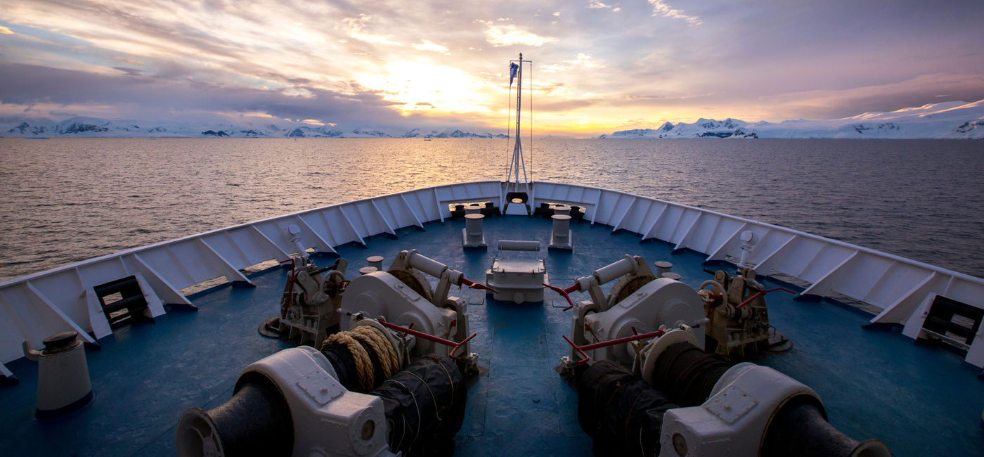 Image: Antarctica ship bow and sky. (photo via Adventure Life)