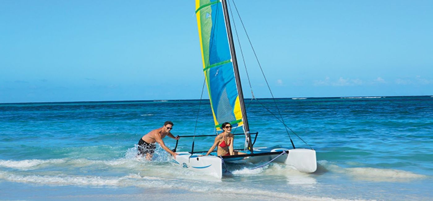 Image: PHOTO: Couple sailing a hobie cat at Now Larimar Punta Cana. (photo via AMResorts) (Now Resorts & Spas)