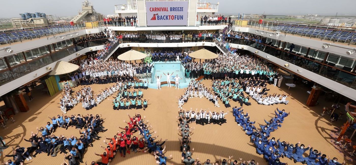 Image: The crew on Carnival Breeze, one of the ships that has returned to service in July 2021. (Photo via Carnival Cruise Line) (Carnival Cruise LIne)
