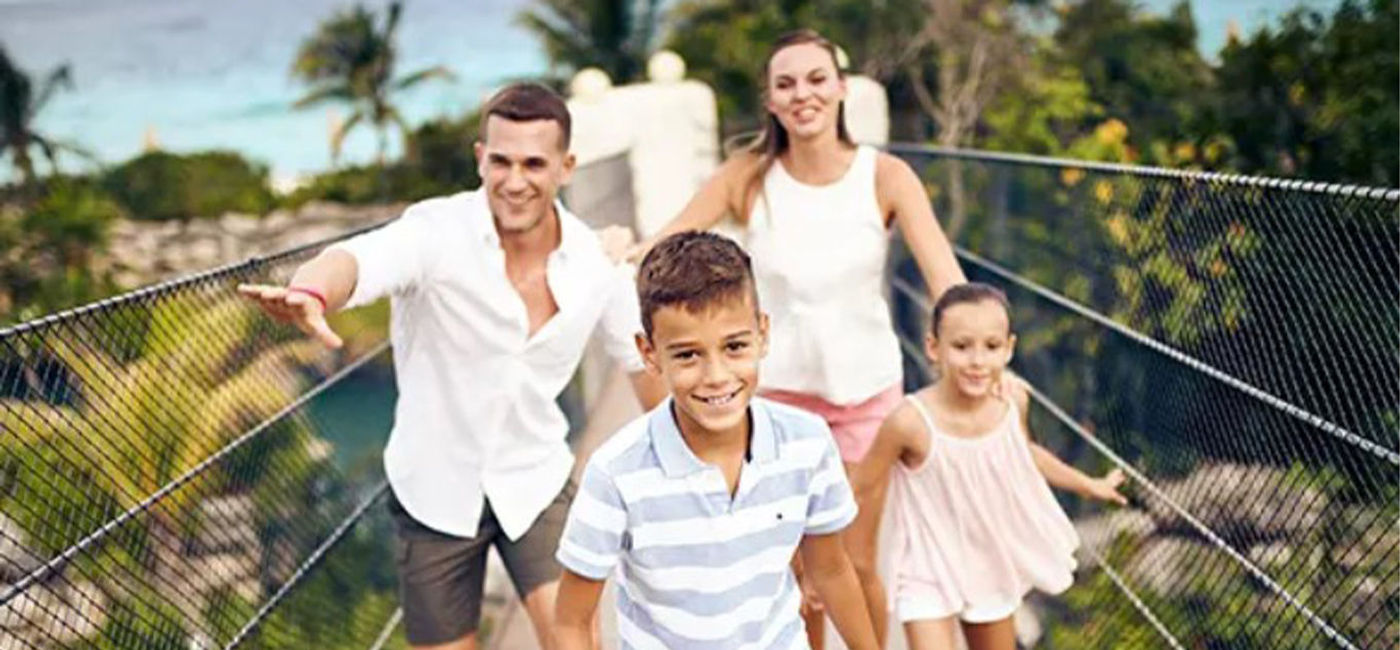 Image: A family visits Hotel Xcaret México (Courtesy of Hotel Xcaret Mexico).