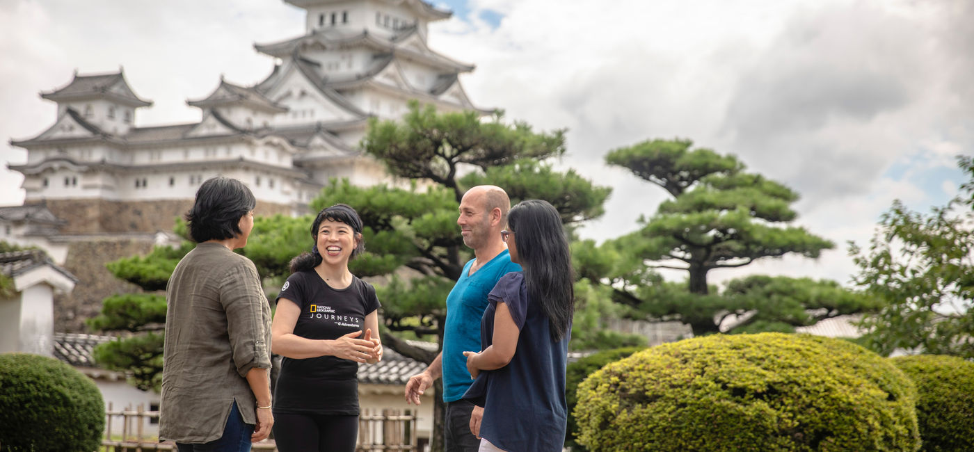 Image: Travelers standing before the Himeji Castle in Himeji, Japan. (photo via G Adventures) ((photo via G Adventures))