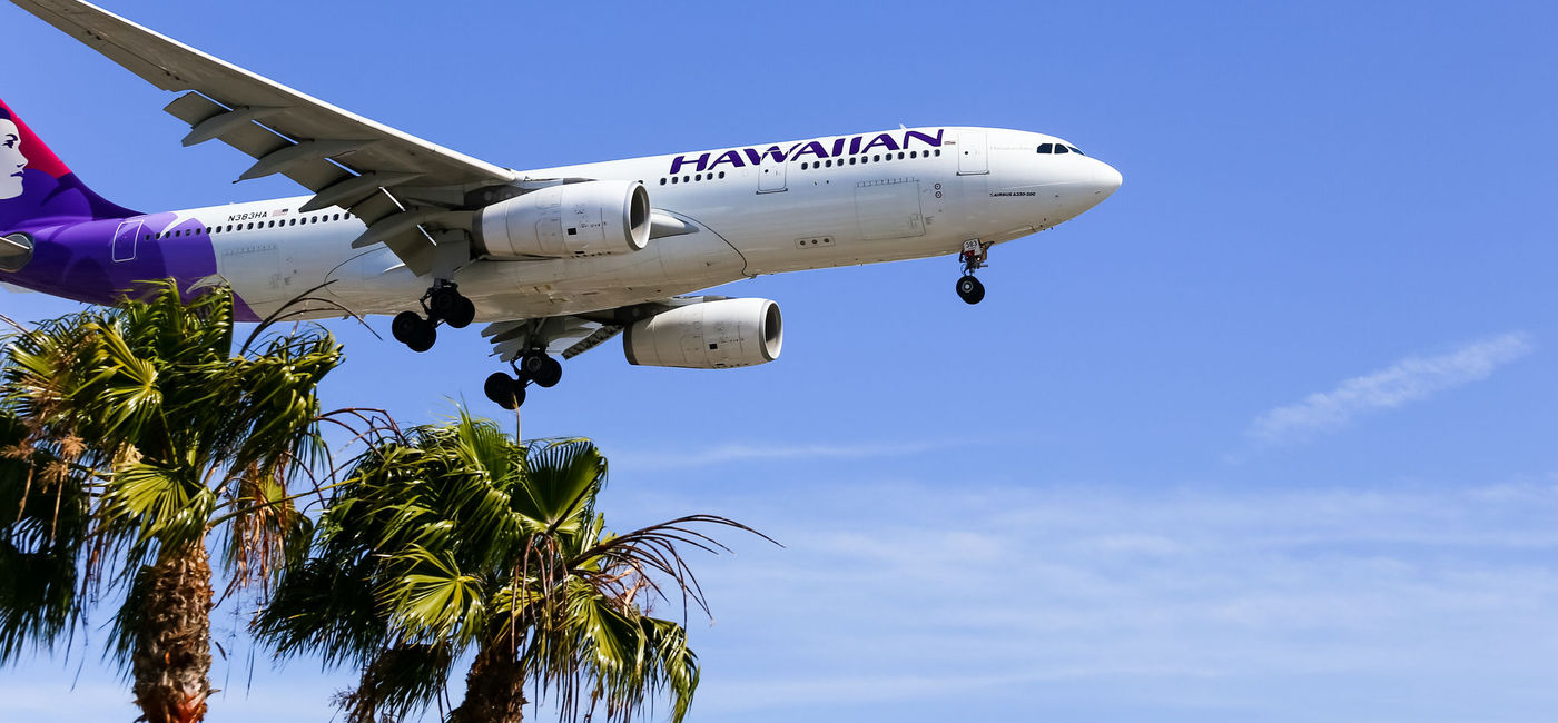 Image: PHOTO: Hawaiian Airlines plane landing at Los Angeles International Airport. (photo via mixmotive/iStock Editorial/Getty Images Plus)