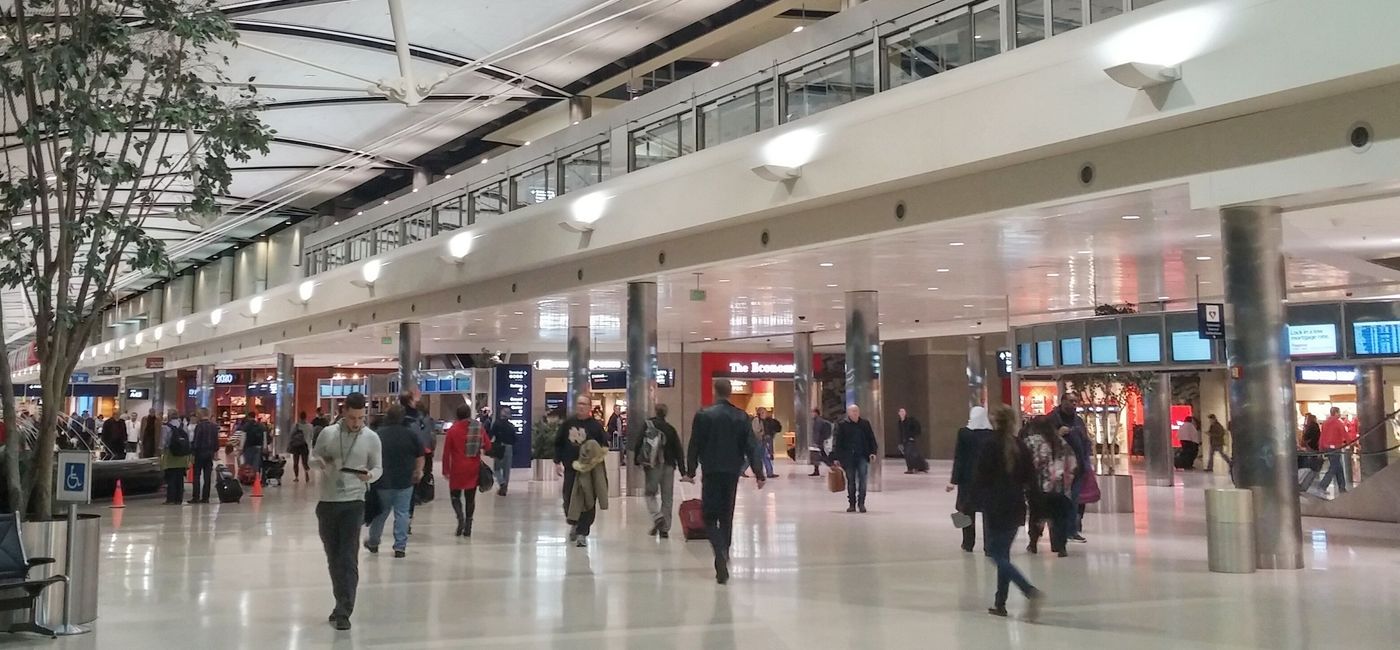 Image: PHOTO: Travelers walking through a terminal at Detroit Metropolitan Airport. (photo via KatieDobies/iStock Editorial/Getty Images Plus)