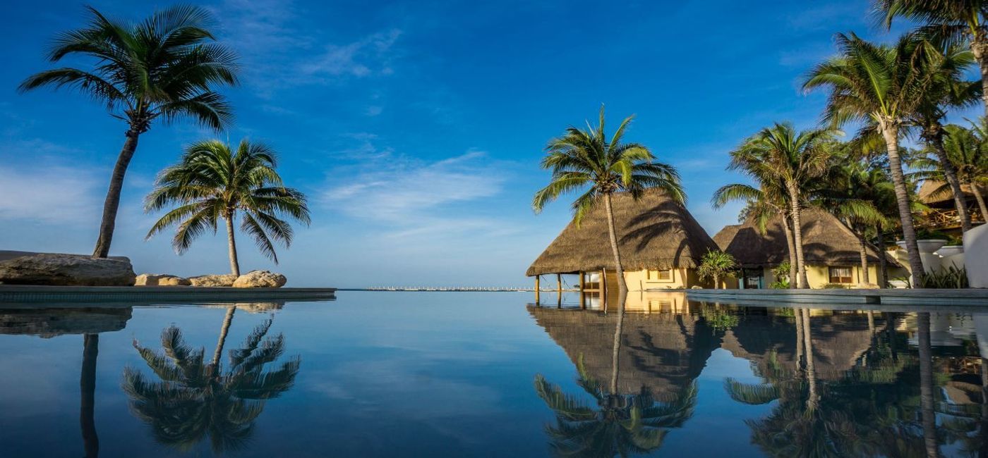 Image: PHOTO: Some water-side bungalows of Mahekal Beach Resort. (photo via Zimmerman) (Mahekal Beach Resort)