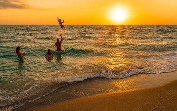A family playing in the ocean