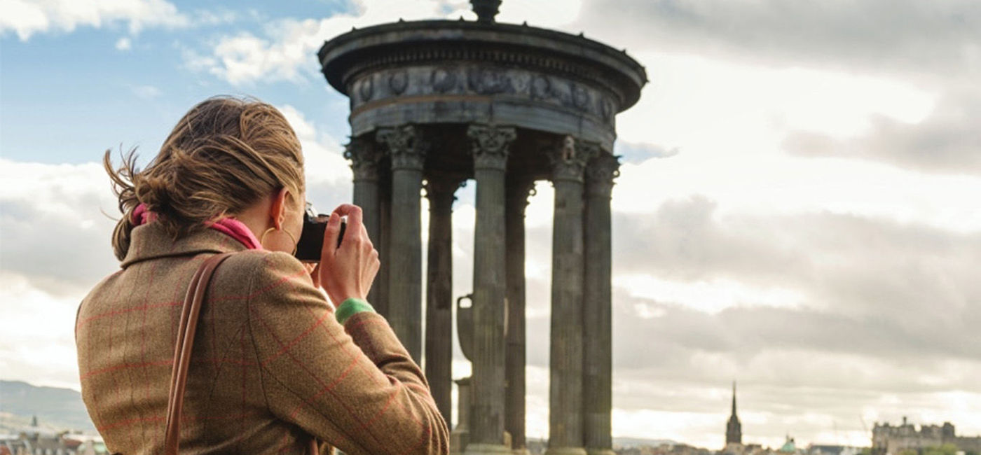 Image: Photographer in Scotland (photo courtesy CIE Tours)