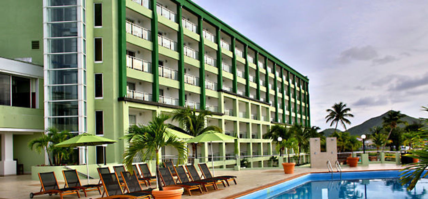 Image: PHOTO: The main Flamboyant building and Upper Pool at Sonesta Great Bay Beach Resort. (photo courtesy of Sonesta St. Maarten Resorts)