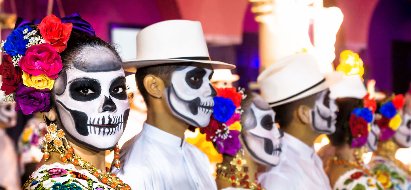 Image: Painted dancers on Dia de Muertos in Mexico. (Photo via iStock Editorial / Getty Images Plus / loeskieboom)